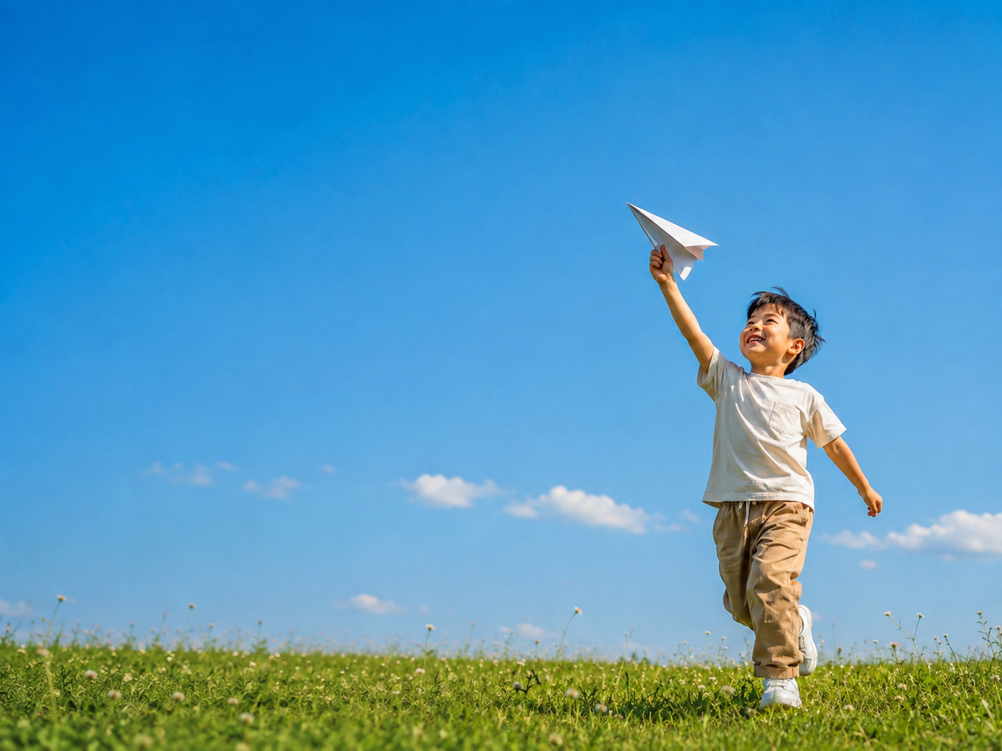 Child running toward the future with a paper airplane